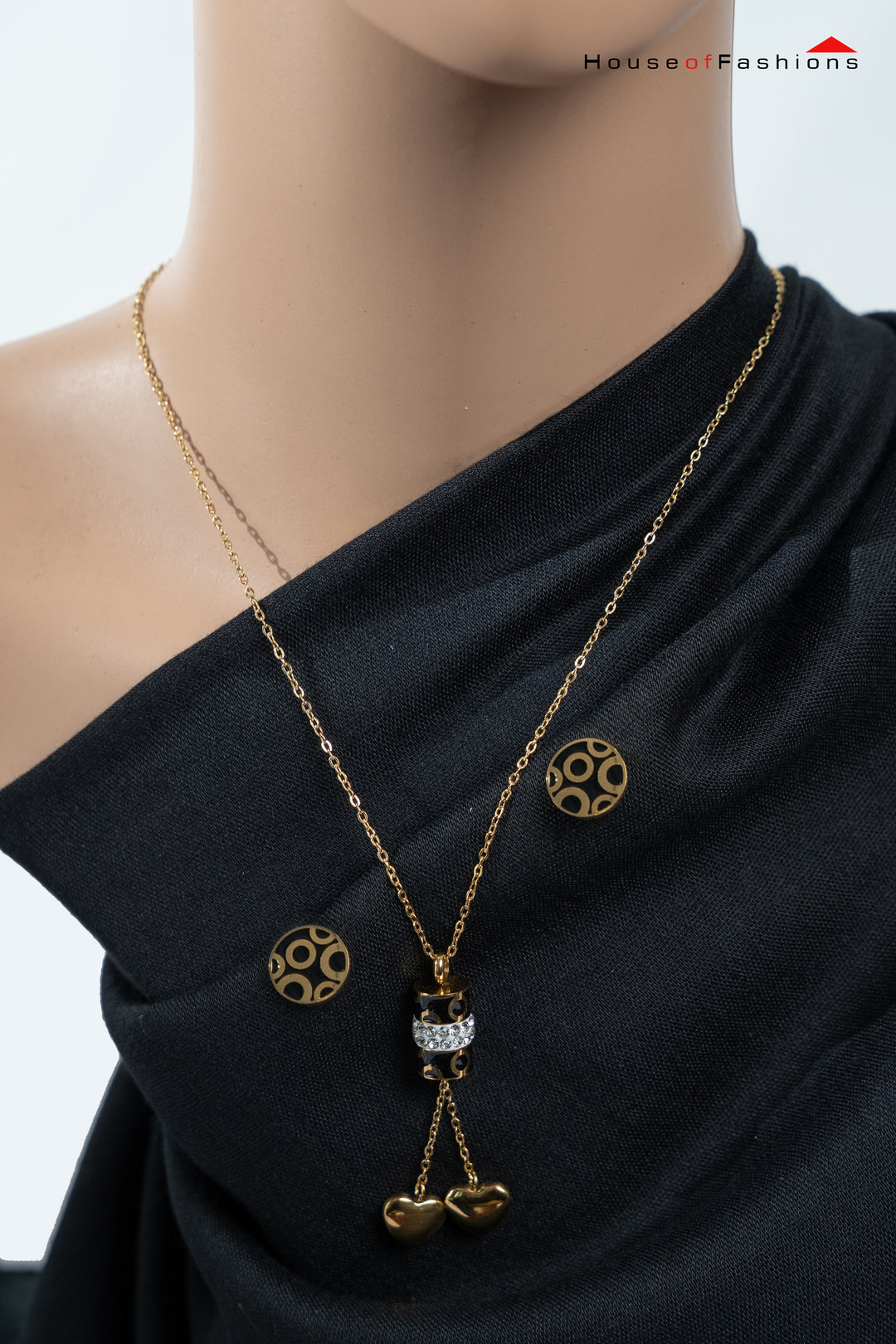 3-Piece 18K Gold Plated Jewelry Set with circle necklace and matching earrings on a black fabric background